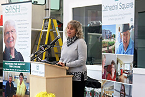 Cathedral Square CEO addresses the audience at the Bayview Crossing opening celebration.