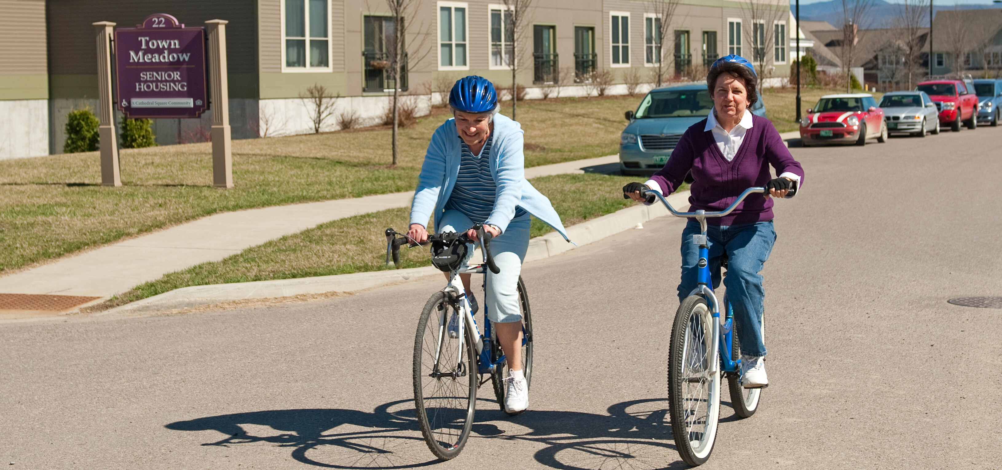 Two people riding bikes