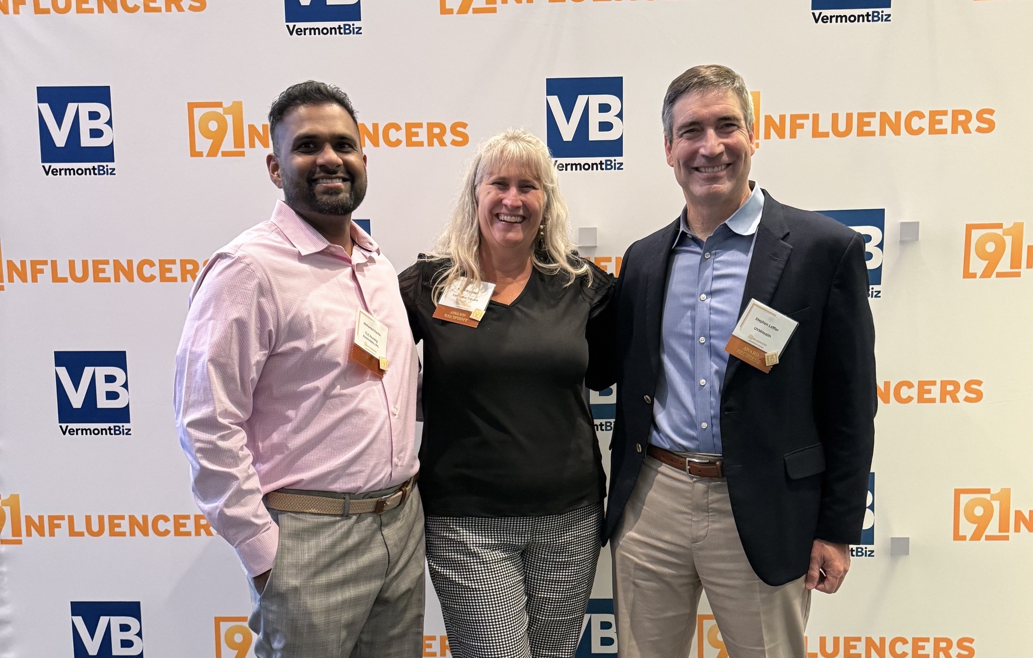 Cathedral Square CEO Kim Fitzgerald (center) celebrates her 91 Influencers award with fellow 2026 honorees Mohamed Basha, Owner & CEO of TLC Nursing Associates (left), and Dr. Stephen Leffler, President & COO of UVM Health (right).